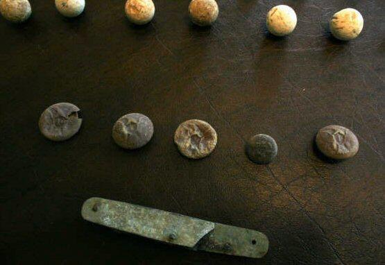 Buttons recovered from a Pea Ridge Campaign Associated Campsite .
