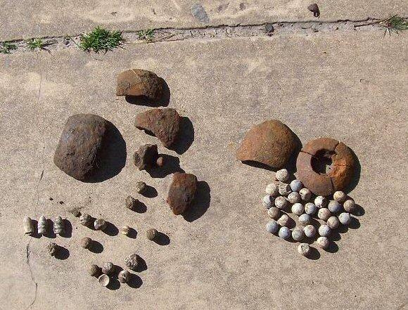 A week later, they're still carrying off the iron, and James dug the 4 frags & 26 case-shot balls from one hole.