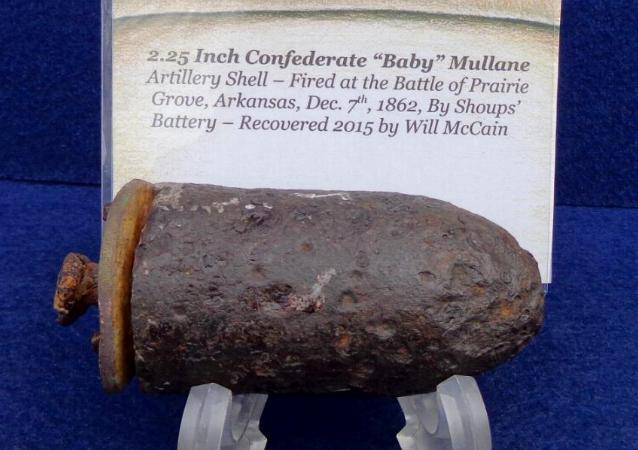 Will McCain's 2.25 inch Confederate "Baby Mullane" Artillery Shell after about an hour and a half of being suspended upside down in the electrolysis tank. Managed to keep the copper disc sabot out of the solution, preserving its wonderful green patina. Did not want to overdue it with the electrolysis, so after a visual inspection, concluded at that point. 