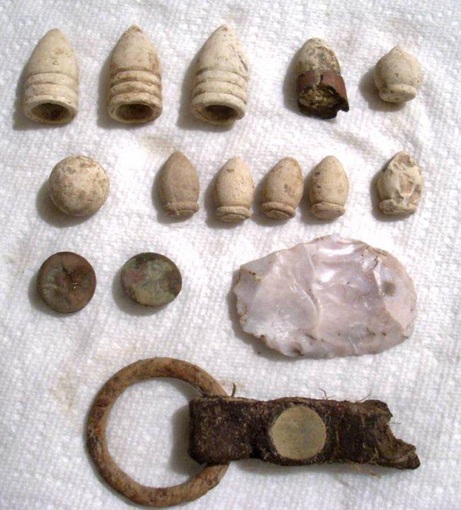 Nice bunch of artifacts recovered by Mark Daughtrey. Note the strange little bullet in the upper right corner !? 