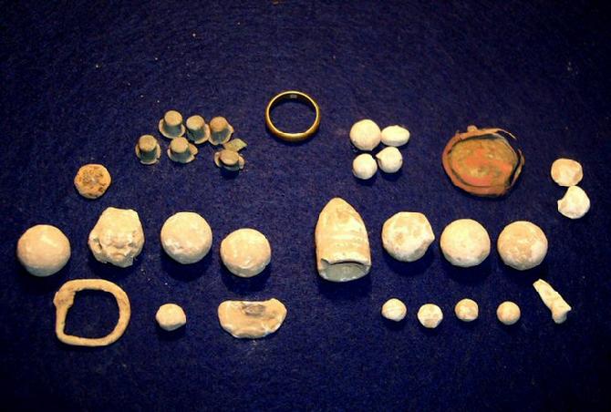Relics recovered Sunday, 5-13-12, include several musket balls & buck balls, nice conical .69 bullet, badge piece, spur buckle, percussion caps, & gold wedding band.