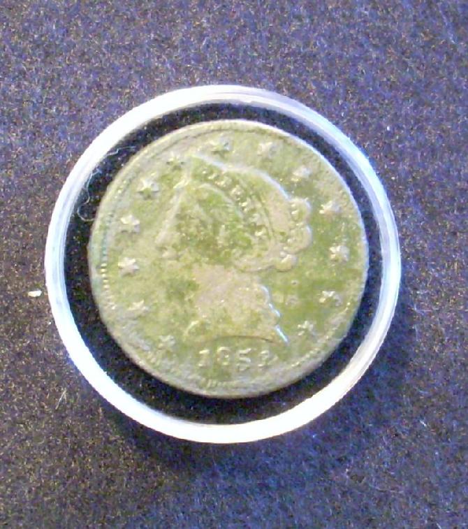 Mark Daughtrey's counterfeit Gold Coin, made of brass it must have once been gilted.