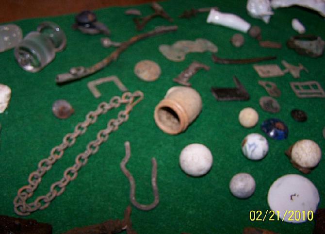 Nice brass chain, pipe bowl, marbles, and buttons.